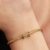 Besos-Charm mit Schriftzug, 14-karätig vergoldet Besos-Charm mit Schriftzug, 14-karätig vergoldet