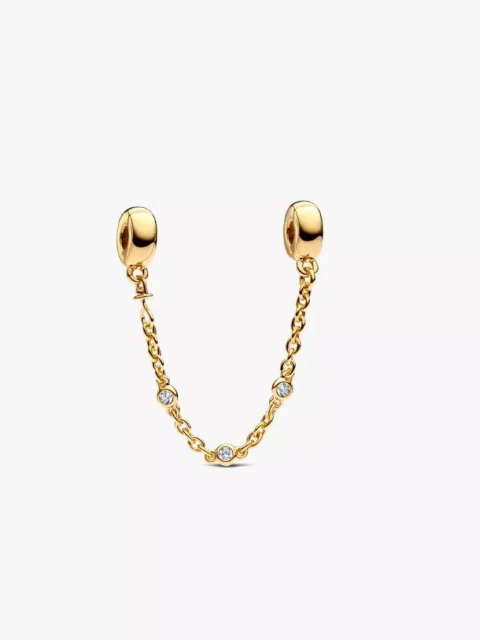 Dreifache Safety Chain mit klaren Steinen, 14-karätig vergoldet Dreifache Safety Chain mit klaren Steinen, 14-karätig vergoldet
