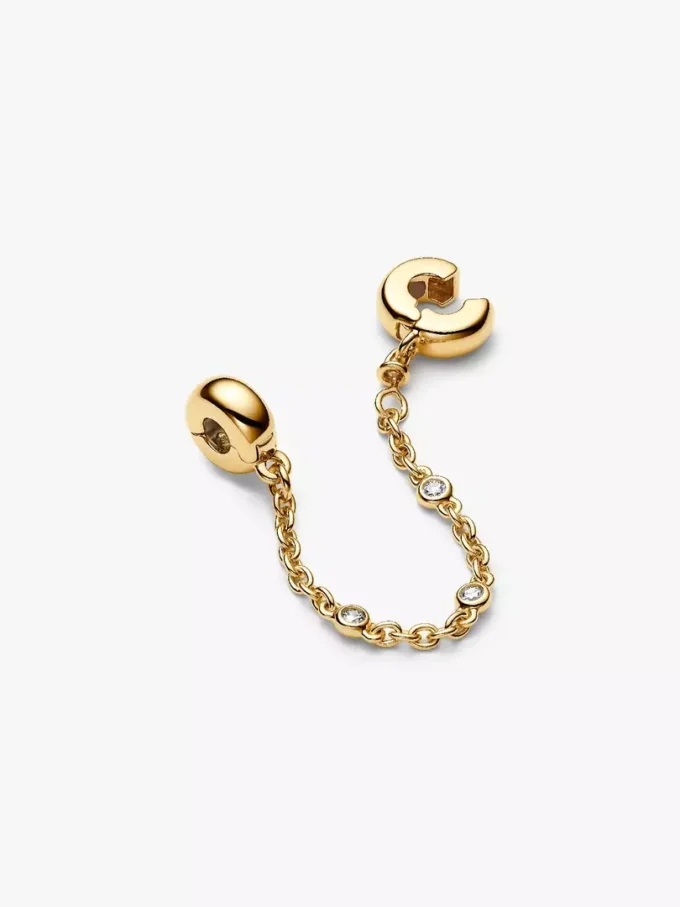 Dreifache Safety Chain mit klaren Steinen, 14-karätig vergoldet Dreifache Safety Chain mit klaren Steinen, 14-karätig vergoldet