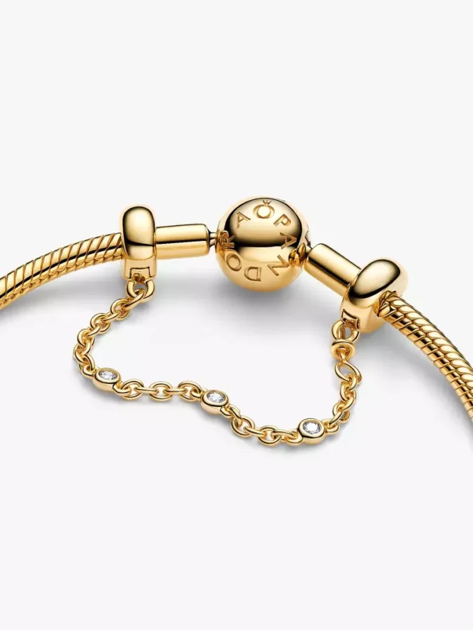 Dreifache Safety Chain mit klaren Steinen, 14-karätig vergoldet Dreifache Safety Chain mit klaren Steinen, 14-karätig vergoldet