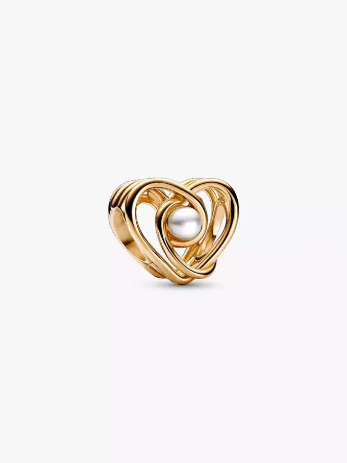 Durchbrochener, wirbelnder Herz-Charm & behandelte Süßwasserzuchtperle aus 14 Karat Gold Durchbrochener, wirbelnder Herz-Charm & behandelte Süßwasserzuchtperle aus 14 Karat Gold