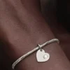 Gravierbarer Herz-Dangle Charm mit weißem Stein aus Sterlingsilber Gravierbarer Herz-Dangle Charm mit weißem Stein aus Sterlingsilber