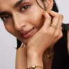 Armband mit rundem Verschluss und Flügelkette, 14-karätig vergoldet Armband mit rundem Verschluss und Flügelkette, 14-karätig vergoldet